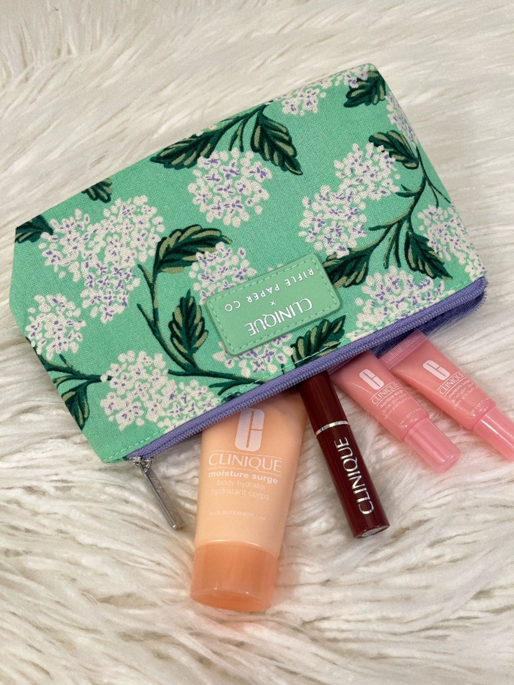 Clinique "Cosmetic bag in floral with goodies" NWT